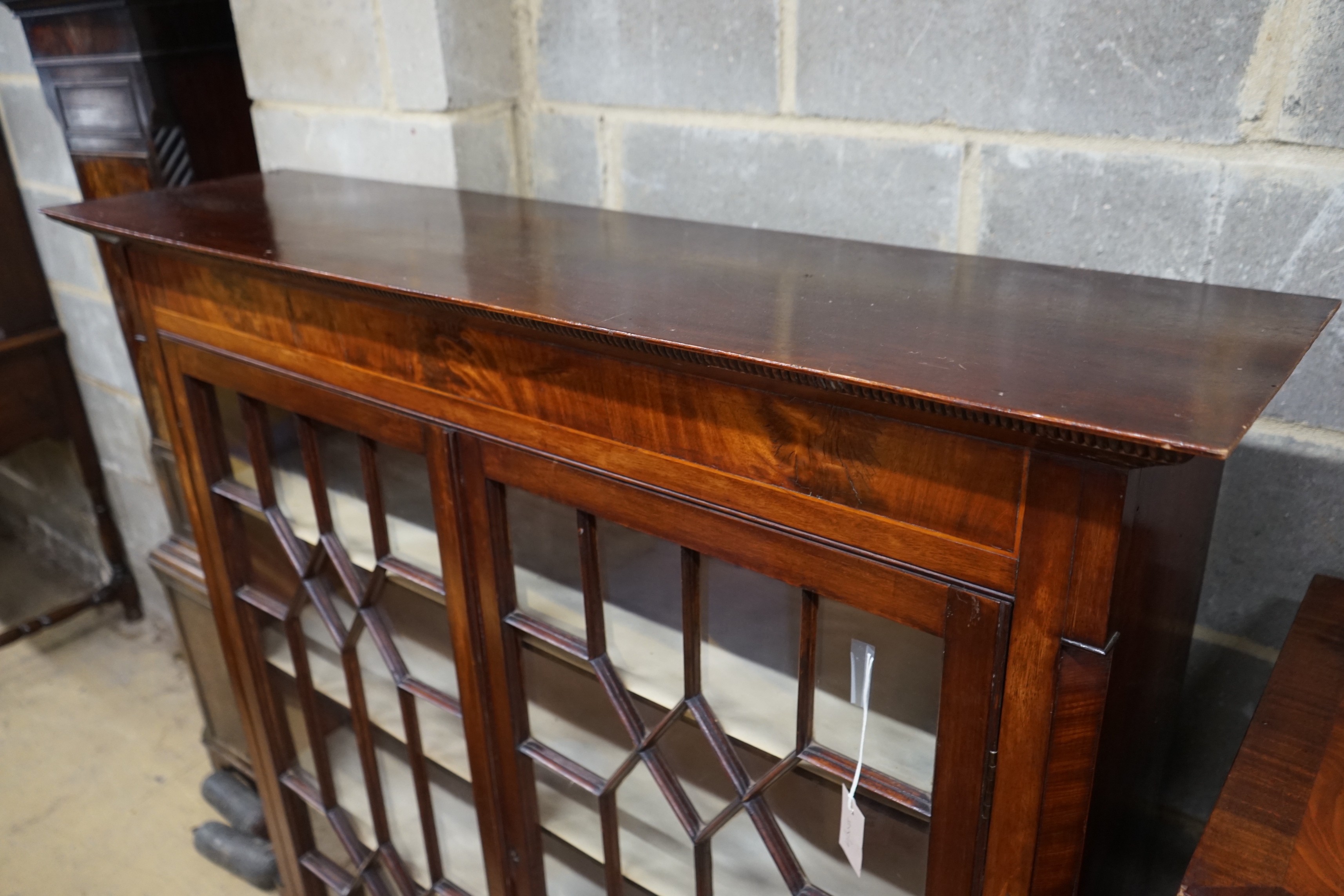 A George III and later mahogany bookcase (altered), length 128cm, depth 33cm, height 129cm